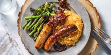 Honey Mustard Sausages and Sticky Red Onion Gravy with Sweet Potato Mash and Tenderstem Broccoli Recipe