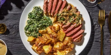 Succulent Sirloin Steak and Creamy Peppercorn Sauce with Roasties and Creamed Spinach Recipe